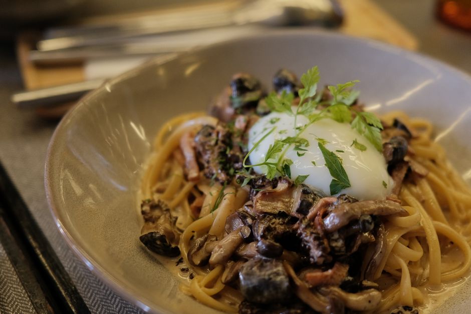 Mushroom pasta in a bowl with herbs