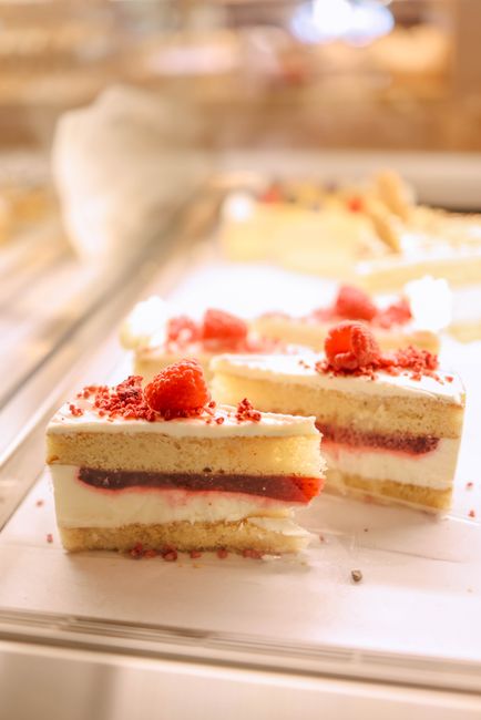 Slices of cream sponge cake with berries